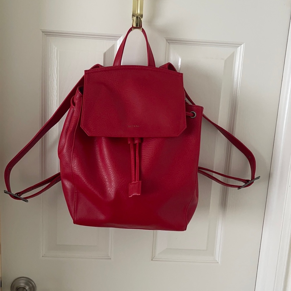A red Matt & Nat backpack
